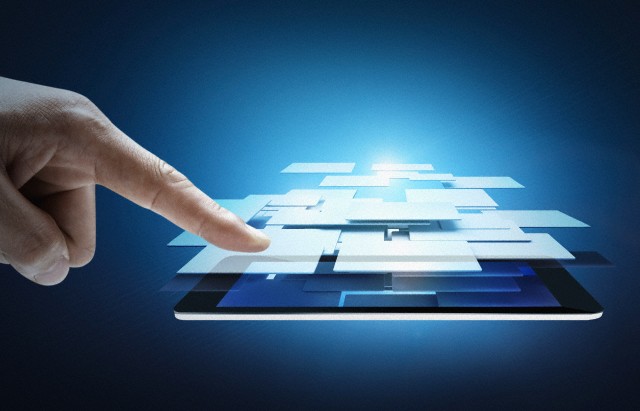 A business man pointing at a tablet